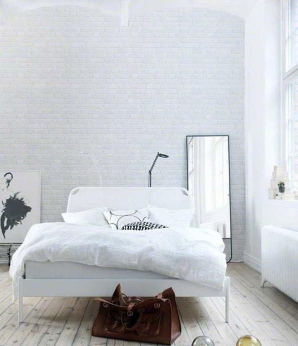 Imitazione di mattoni bianchi in camera da letto