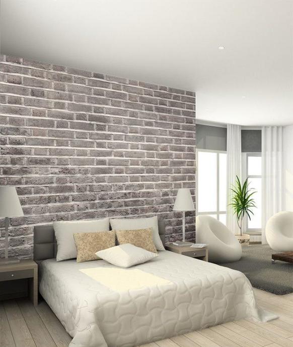 Progettazione di una camera da letto con carta da parati in mattoni grigi