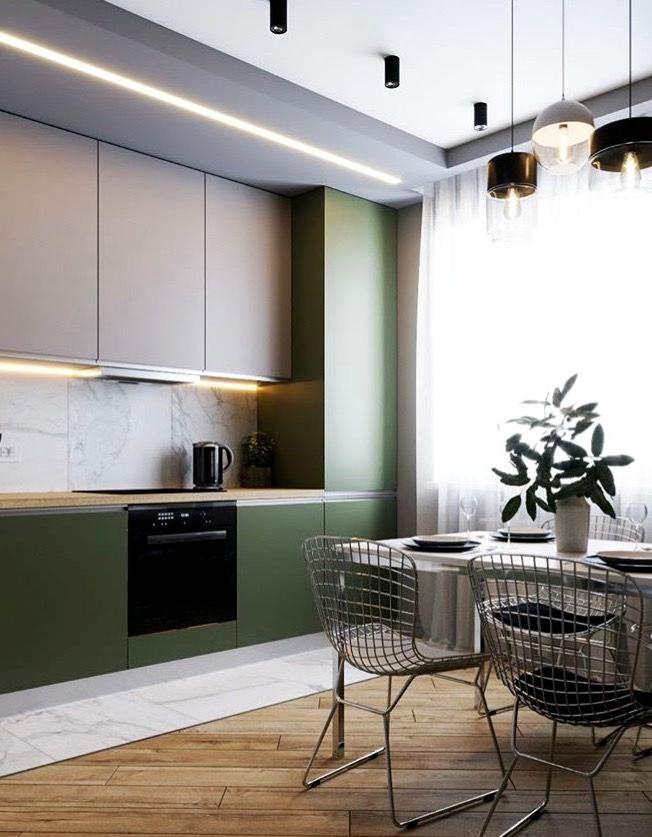Armadi verdi glassati in una cucina moderna