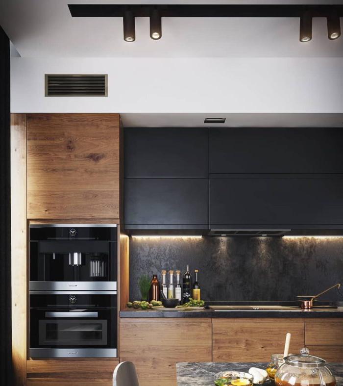Nero, grigio, bianco e legno all'interno della cucina